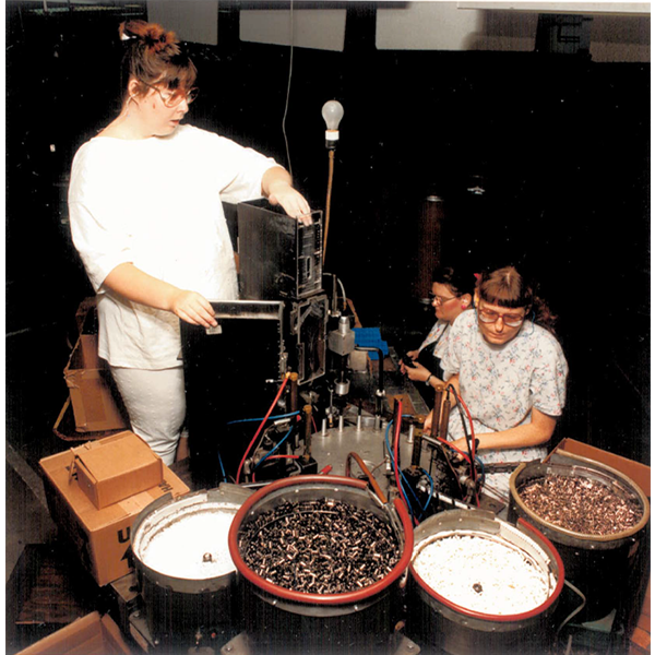 Employees assembling pens at Industries of the Blind Greensboro in the 1990s