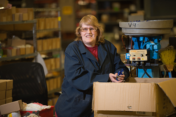 Susan Kasten assembles pens at Industries for the Blind